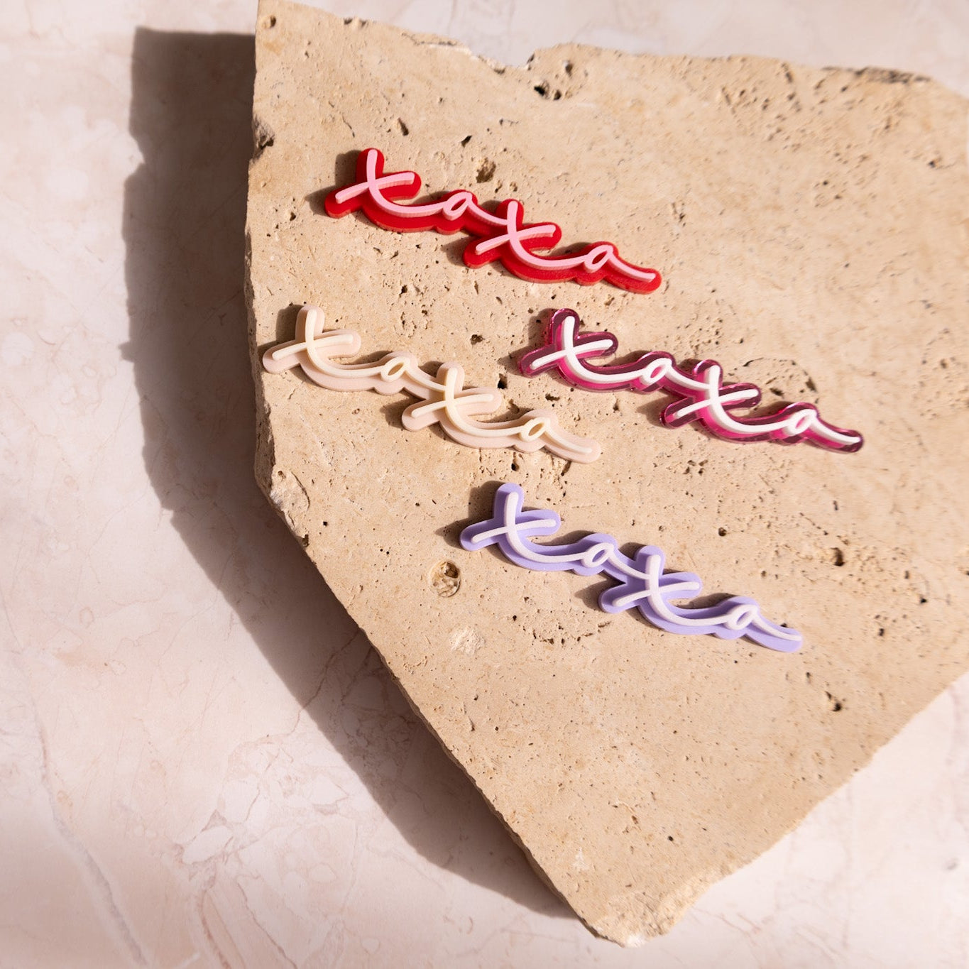 set of four xoxo cupcake charms in a lower case cursive font