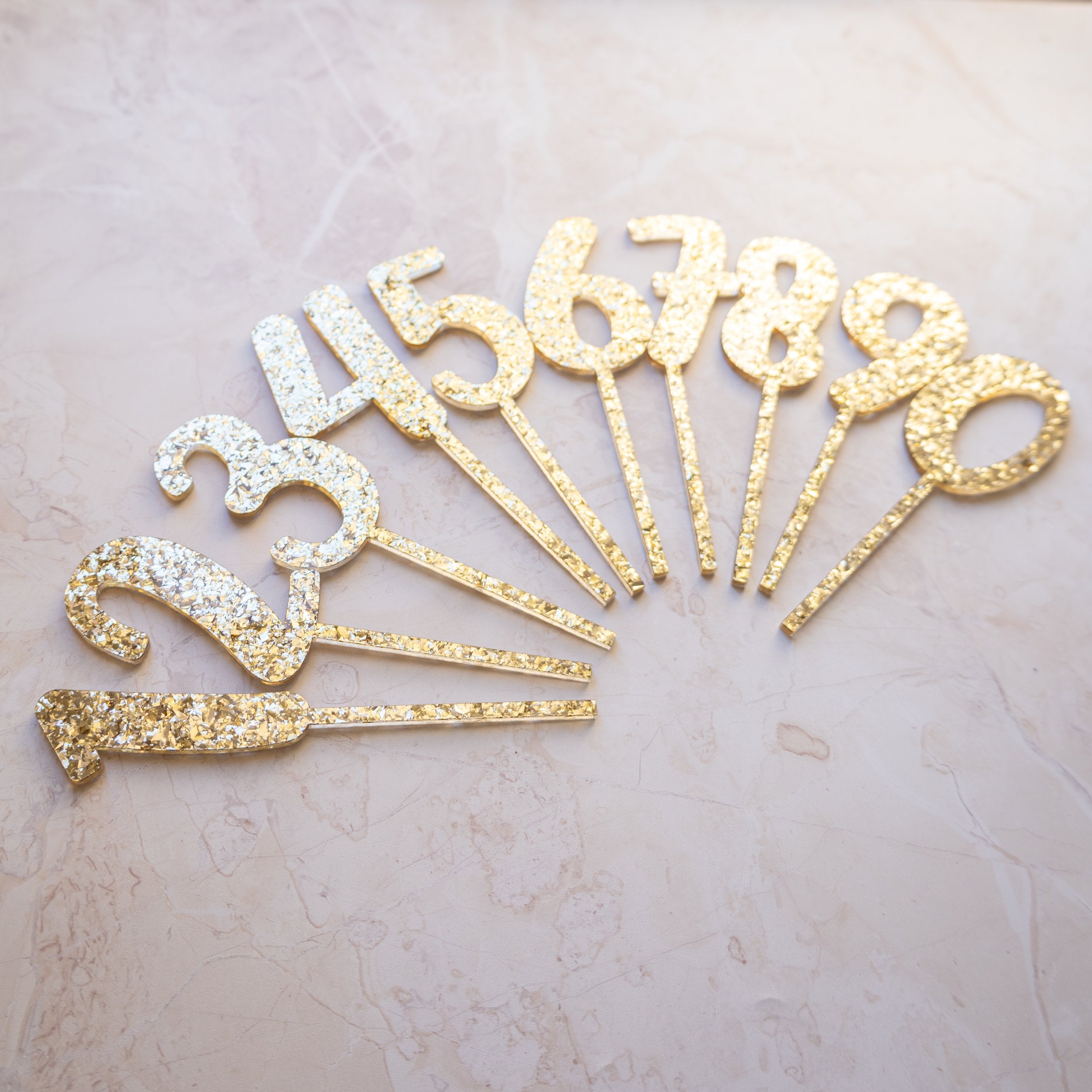 set of number cake toppers 0-9 in gold glitter acrylic